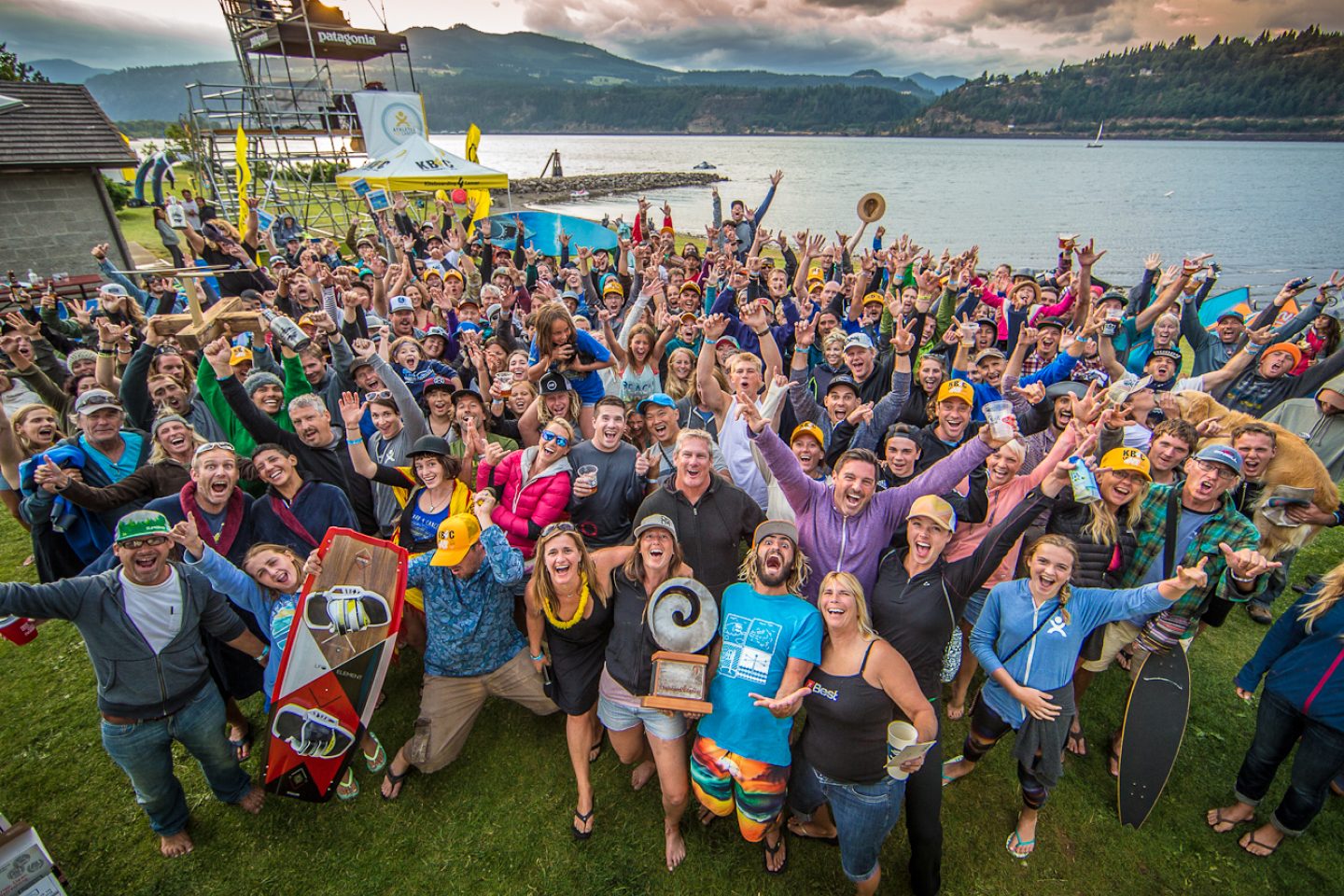 a large group of athletes cheering on the Hood River waterfront