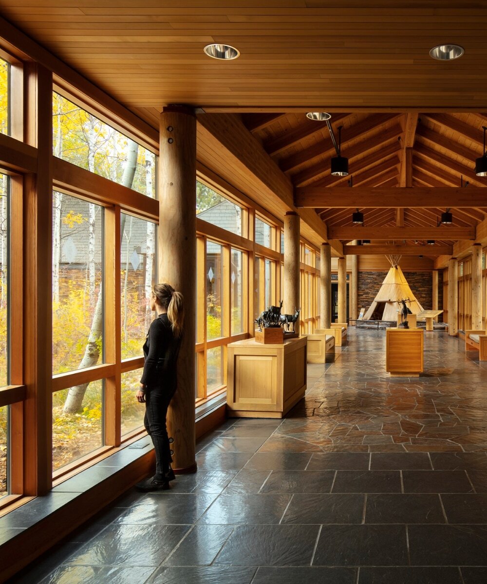 A guest looks out the window of the museum