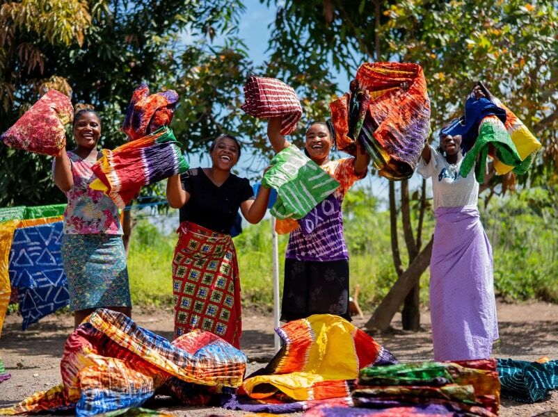 A group of women smiling for a photo